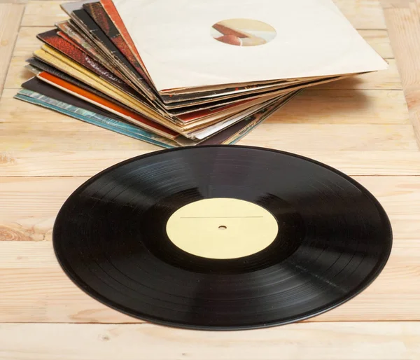 Vinyl record with copy space in front of a collection