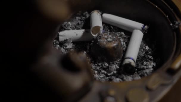 A few cigarettes are in the ashtray — Stock Video