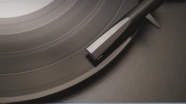 a vinyl record is played in the player