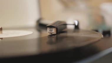 a vinyl record is played in the player