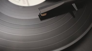 a vinyl record is played in the player