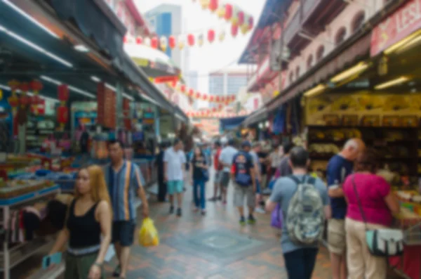 Soyut bulanıklık. Singapur Chinatown pazarda kalabalık yol