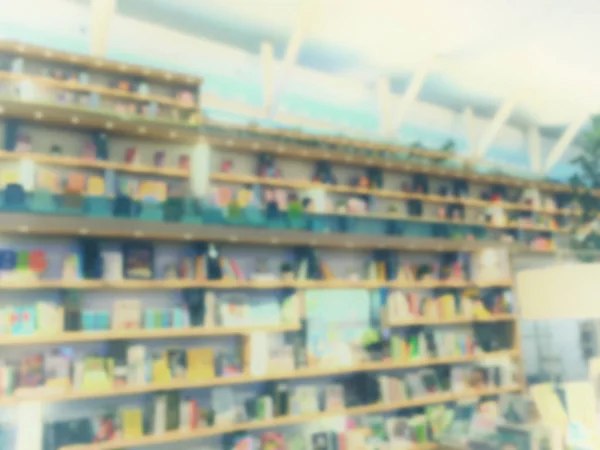 Vintage style color tone.Blur image of a bookstore . — Stock Photo, Image