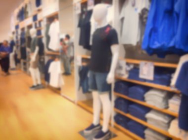 Bulanık görüntü arka plan giyim mağazasında alışveriş merkezi ile.