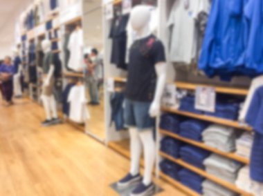 Bulanık görüntü arka plan giyim mağazasında alışveriş merkezi ile.