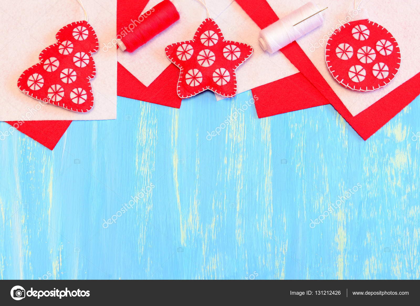Christmas tree ornaments on blue wooden background with copy space
