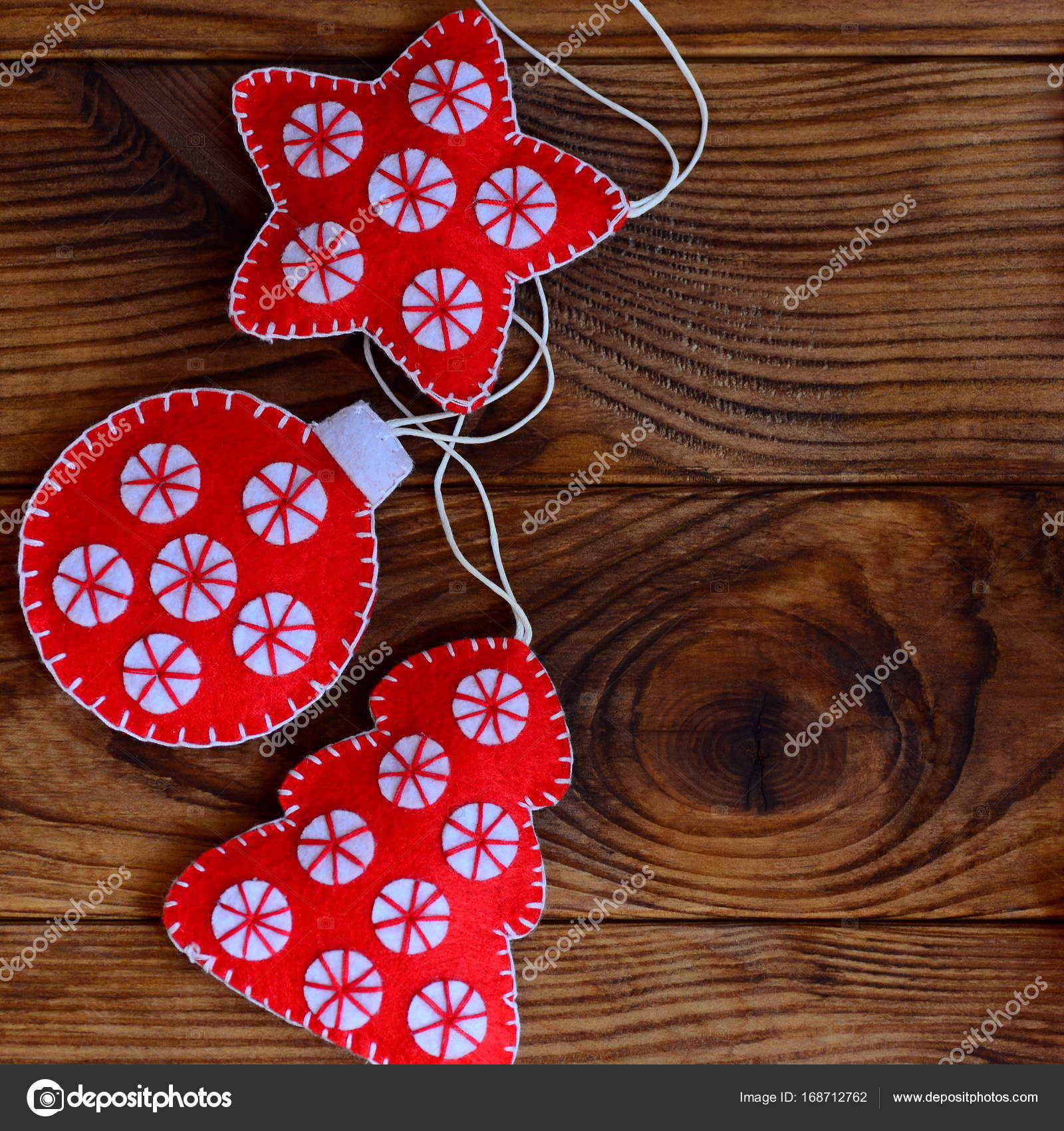 Homemade Christmas crafts made from red and white felt sheets. Felt star,  Christmas tree and ball