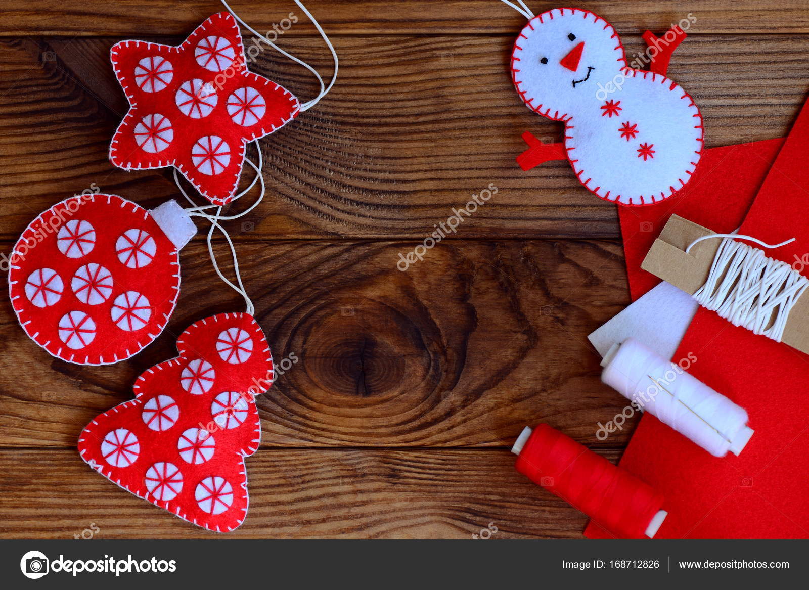 Christmas crafts to make at home. Felt star, Christmas tree, snowman and  ball on a brown