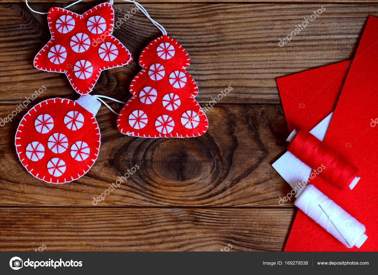 Red felt Christmas tree decor, scissors, red and white felt sheets