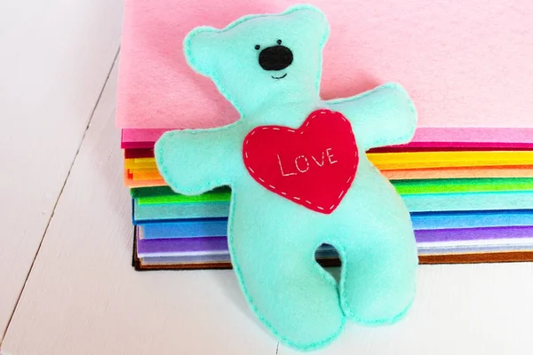 Blue felt bear toy with red heart. Valentines Day crafts. Valentines Day toy gift