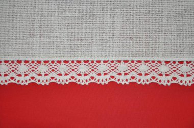 Dantelli kırmızı ve tekstil kumaş Fildişi beyaz arka plan yatay doku