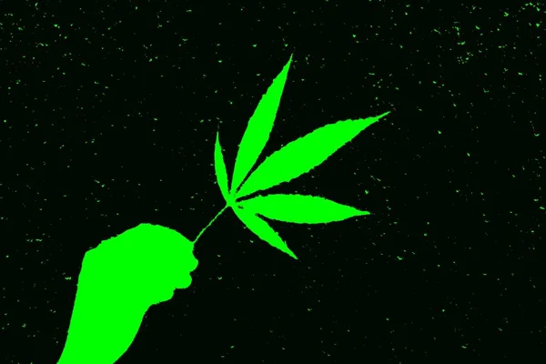 Neon parlak yeşil soyut marihuana yaprağı el karanlıkta — Stok fotoğraf