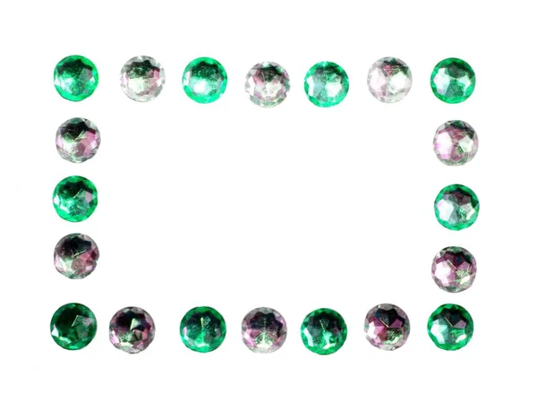 Зеленый и серебристый глянцевый блеск кольца драгоценные камни продолговатый фон рамки — стоковое фото