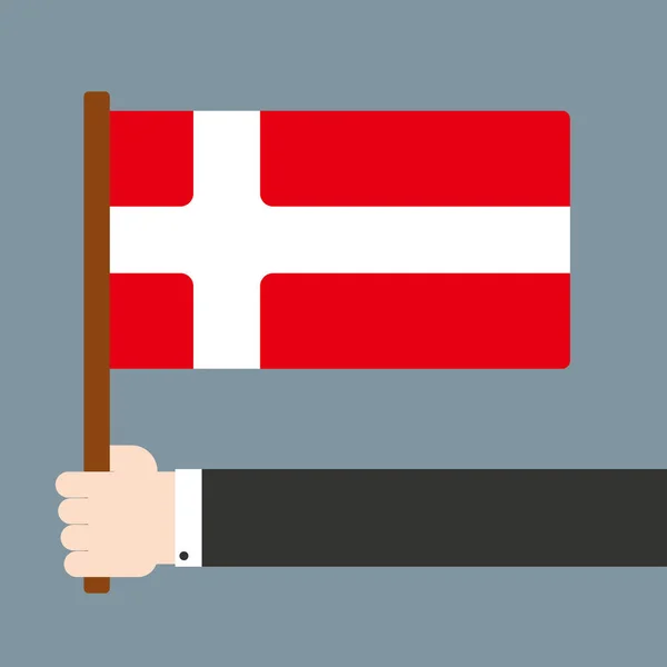 Mão segurando bandeira Dinamarca — Fotografia de Stock