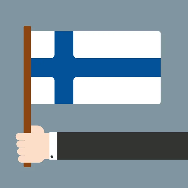 手拿着芬兰国旗 — 图库照片