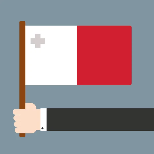 Mão segurando bandeira Malta — Fotografia de Stock