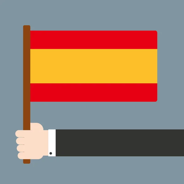 Mano sosteniendo bandera de España — Foto de Stock