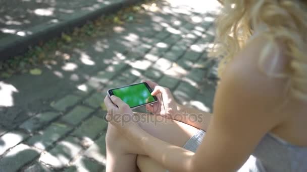 Young Women Using Cell Phone Park Green Screen — Stock Video