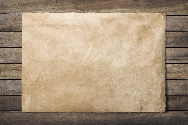 Old paper sheet at wooden background  clipping path — Stock Photo, Image