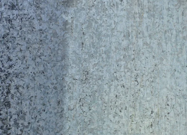 Gray steel background. Metal surface with dots and scratches. Retro wallpaper - aged steel surface.