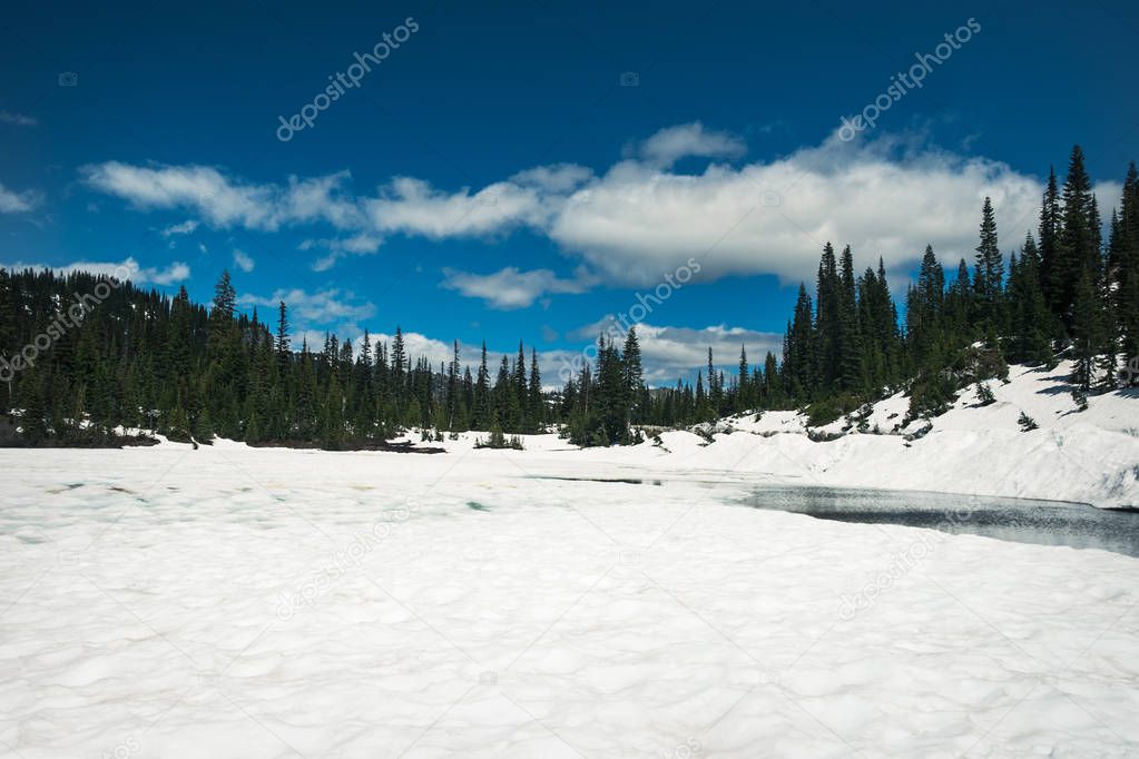Snow-covered Reflection Lake in Mount Rainier National Park during June