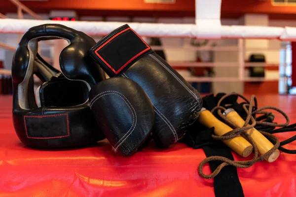 Sports equipment for a fighter. Protective helmet of a fighter. Fighting gloves.