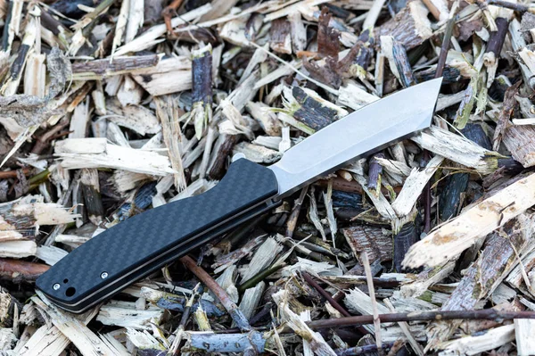 Pocket knife with a carbon handle. Knife handle with a pattern. Top of the knife. — Stock Photo, Image