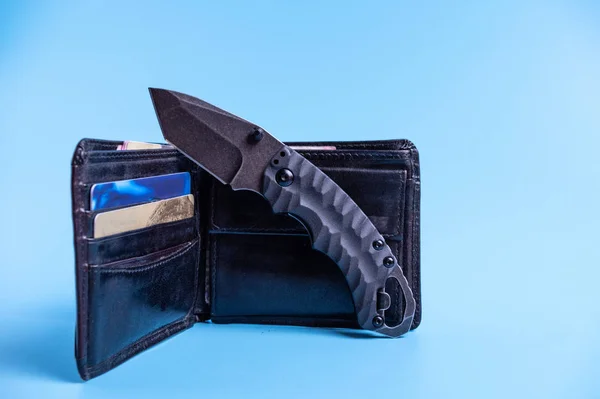 Small black knife with a tanto blade. Knife and wallet. — ストック写真