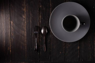 Saucer and a mug. Coffee set and appliances. Low key.