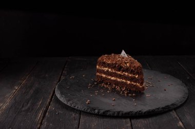 Chocolate pie. A piece of chocolate cake. Cake and chocolate chips.