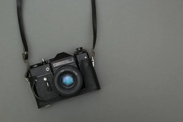 Retro photo camera on a strap — Stock Photo, Image