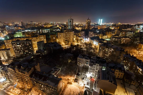 Top view of buildings in the city of Kyiv at night in winter