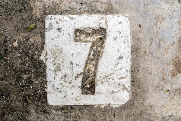 Le cifre con cemento sul marciapiede 7 — Foto Stock