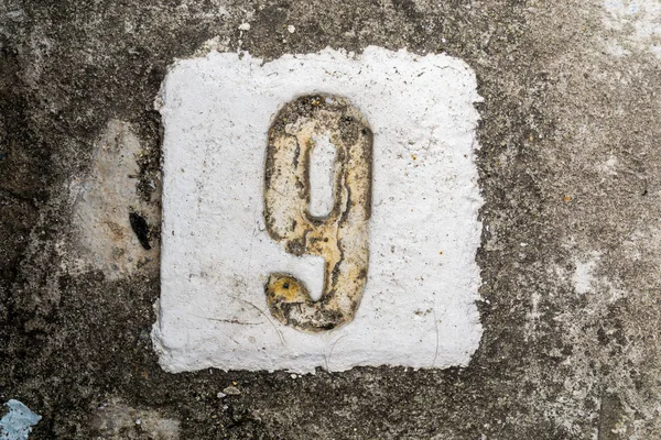Le cifre con cemento sul marciapiede 9 — Foto Stock