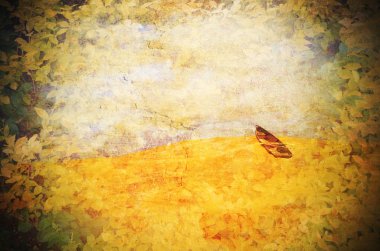 Surreal row boat marooned in the desert. Grunge textured image. clipart