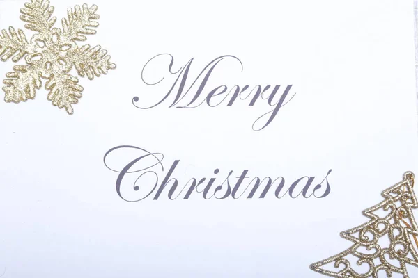 Text merry christmas on paper with gold decoration — Stock Photo, Image