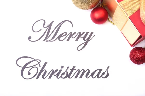 Text merry christmas on paper with many balls — Stock Photo, Image