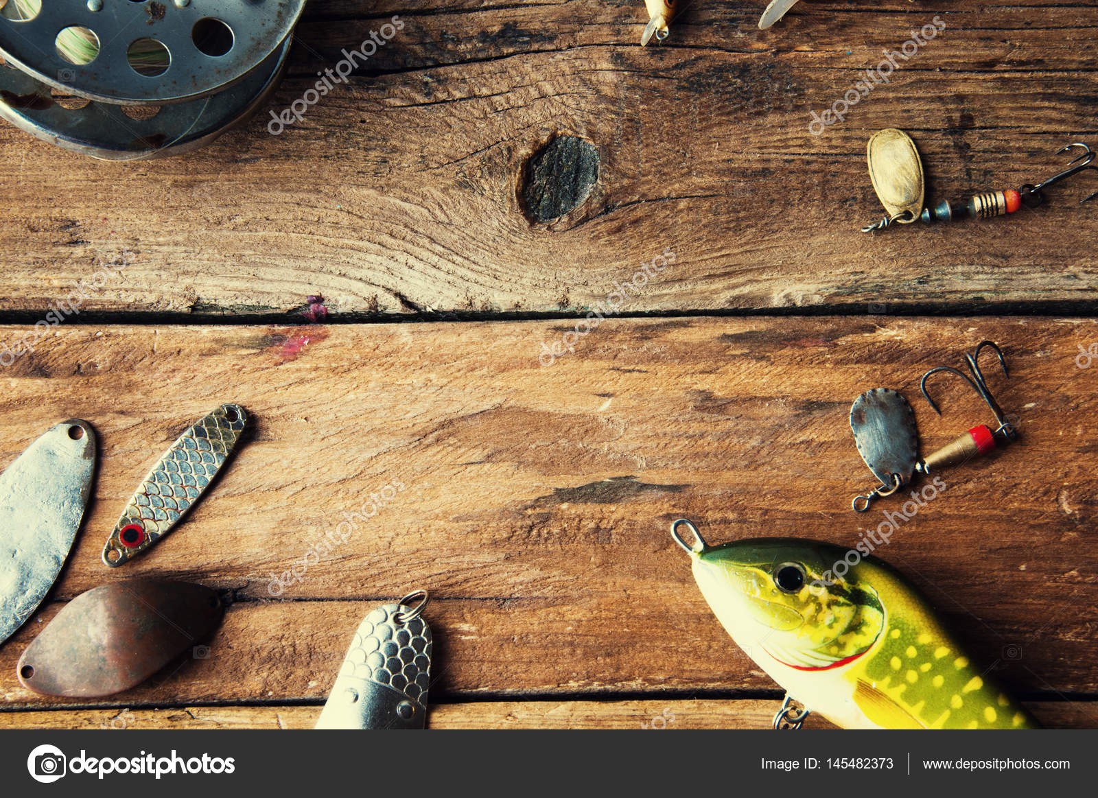 Fishing lures on wooden background. Copyspace Stock Photo by  ©monika.w20.wp.pl 145482373