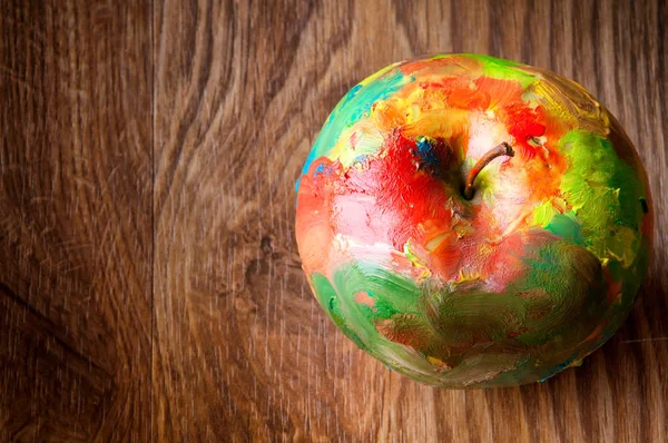 Oil painted apple on wooden background. Abstract. Copyspace