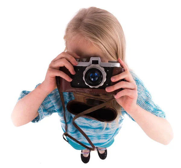 Teen girl with retro camera on a white background — Stock Photo, Image