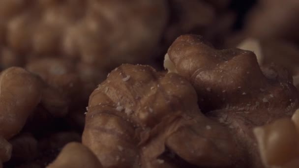 Peeled walnut spins on a plate — Stock Video