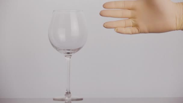 Showing fuck to a wine glass — Stockvideo