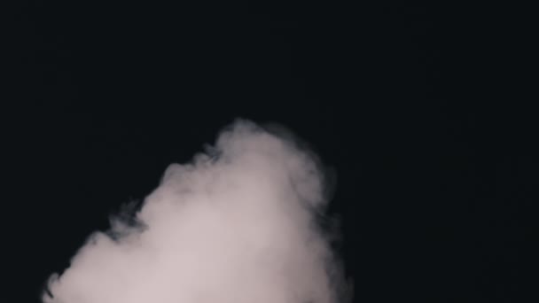 Exhales smoke and smoke slowly falls down — Stock Video