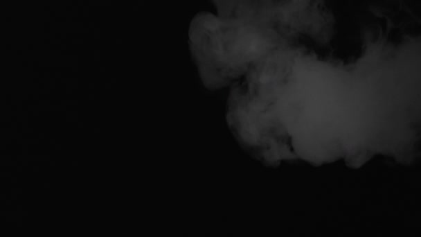 Exhales smoke and smoke slowly falls down — Stock Video