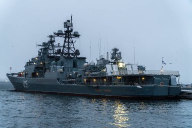Warship at the pier in the city of Severomorsk. clipart