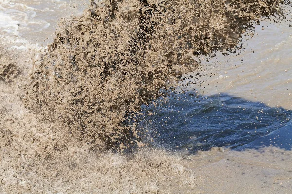 sand and mud in industrial water, note shallow depth of field