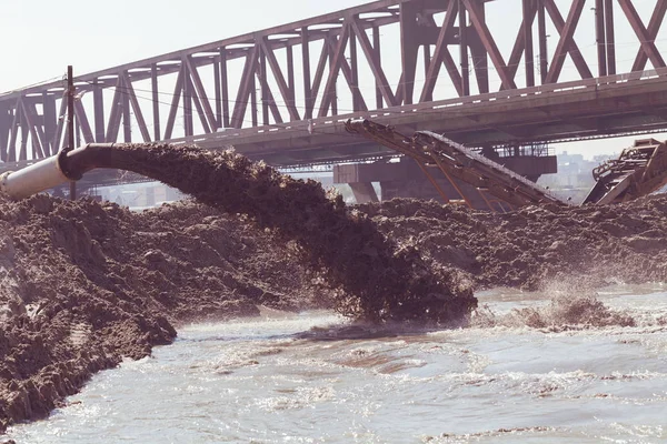 sand and mud in industrial water, note shallow depth of field