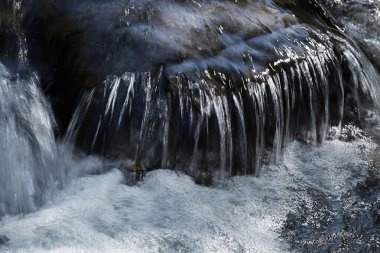 clear mountain running water, note shallow depth of field