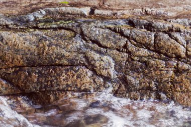 stone under the mountain water, note shallow depth of field