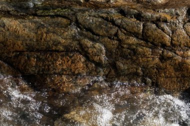 stone under the mountain water, note shallow depth of field